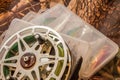 spinning lures in the box and fishing reel Royalty Free Stock Photo