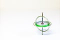 A spinning toy gyroscope isolated on a white background