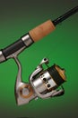 Spinning reel and a cork handled fishing pole Royalty Free Stock Photo