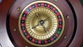 Croupier launches a roulette ball in a casino