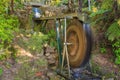 A spinning waterwheel in a scenic woodland setting Royalty Free Stock Photo