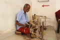 Weaving or Handloom Industry in India. Textile handicraft artisans. Spinning Cotton into thread.