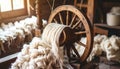 Spinning wheel with wool in a rustic workshop setting Royalty Free Stock Photo