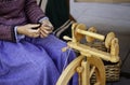 Spinning with a wooden spinning wheel Royalty Free Stock Photo