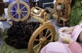 Spinning wool on spinning wheel Royalty Free Stock Photo