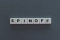 Spinoff word made of square letter word on grey background