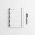 Spiral-bound notebook with lined pages lies open on a white surface Royalty Free Stock Photo