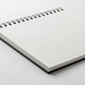 Spiral-bound notebook with lined pages. The wire binding is black, securing the sheets Royalty Free Stock Photo