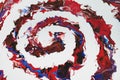 A spiral of burgundy, red, blue colors on a white background. Modern abstract painting Royalty Free Stock Photo