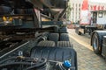 Spiral cable connecting truck cabin and trailer. Pneumatic hoses and electric cables on the coupler of the hitch between a tractor Royalty Free Stock Photo