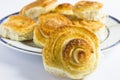 Spiral cinnamon French buns on white background. Royalty Free Stock Photo