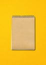 Spiral closed notebook mockup on yellow background Royalty Free Stock Photo