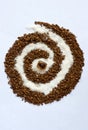 Spiral of coffee and white sugar with a cane sugar Royalty Free Stock Photo