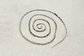 Spiral drawn in sand Royalty Free Stock Photo