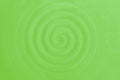 Spiral helix gyre pattern. Ceramic dish, circular vibrations. Light green rippled waves