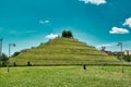 A spiral hill in Portello park with a DNA Monument of Charles Jenks on the top of it