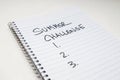 A spiral lined notebook with `Summer Challenge` and 1.2.3 written on it