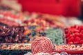 Spiral lolipop surrounded by colorful candy blur Royalty Free Stock Photo