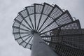 Spiral metal staircase going upwards.