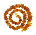 Spiral necklace from rough amber nuggets isolated