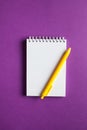 Spiral notebook with pen as a mockup for design on a colored background. The concept of writing text, list. Copy space Royalty Free Stock Photo