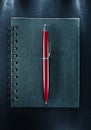 Spiral notebook pen on black background Royalty Free Stock Photo