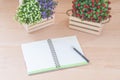 Spiral notebook on wood background Royalty Free Stock Photo