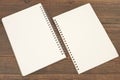 Spiral Notepad And Torn White Blank Page On Wood Background Royalty Free Stock Photo