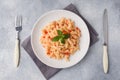 Spiral pasta mixed with cherry tomatoes and tomato sauce on a plate Royalty Free Stock Photo