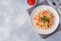 Spiral pasta mixed with cherry tomatoes and tomato sauce on a plate Copy space Royalty Free Stock Photo