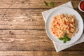Spiral pasta mixed with cherry tomatoes and tomato sauce on a plate. Copy space Royalty Free Stock Photo