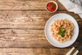 Spiral pasta mixed with cherry tomatoes and tomato sauce on a plate Copy space Royalty Free Stock Photo