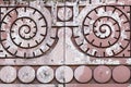 spiral pattern on a red stone wall. architecture Royalty Free Stock Photo