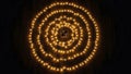 Spiral pattern of warm glowing LED string lights on a dark background creating a mesmerizing visual effect Royalty Free Stock Photo