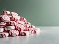 spiral peppermint candies in a pile with green background. Royalty Free Stock Photo