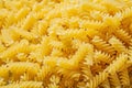 Spiral raw pasta background food and drink concept Royalty Free Stock Photo