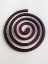 Spiral shaped mosquito coil in white background