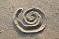 Spiral sign in sand Royalty Free Stock Photo