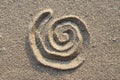 Spiral sign in sand Royalty Free Stock Photo