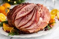 Spiral sliced Christmas ham with orange honey glaze Royalty Free Stock Photo