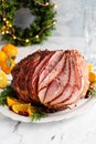 Spiral sliced Christmas ham with orange honey glaze Royalty Free Stock Photo