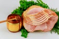 Spiral sliced hickory smoked ham with fresh herb and honey Royalty Free Stock Photo