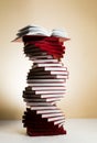 A spiral of stacks of books in the form of DNA and an open textbook at the top. Royalty Free Stock Photo