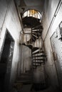 Spiral staircase in an abandoned factory building Royalty Free Stock Photo