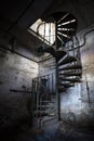 Spiral staircase in an abandoned factory building Royalty Free Stock Photo