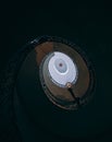 Spiral staircase - abstract detail in a ancient elegant building in the dark