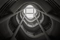 Spiral staircase climbing upward, black and white