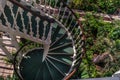 A Spiral staircase in the flower garden Royalty Free Stock Photo