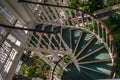 A Spiral staircase in the flower garden Royalty Free Stock Photo