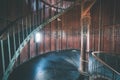 A spiral staircase inside a lighthouse. - vintage film effect